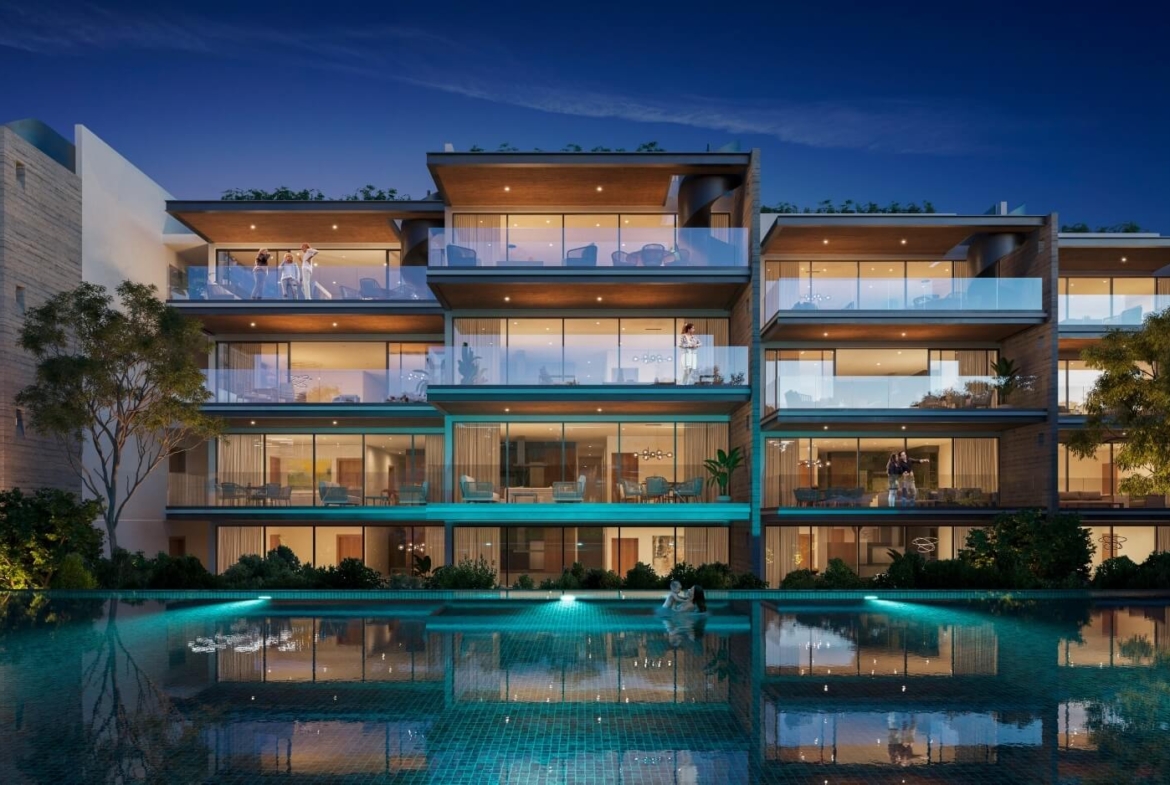 a building with a pool and people in front of it