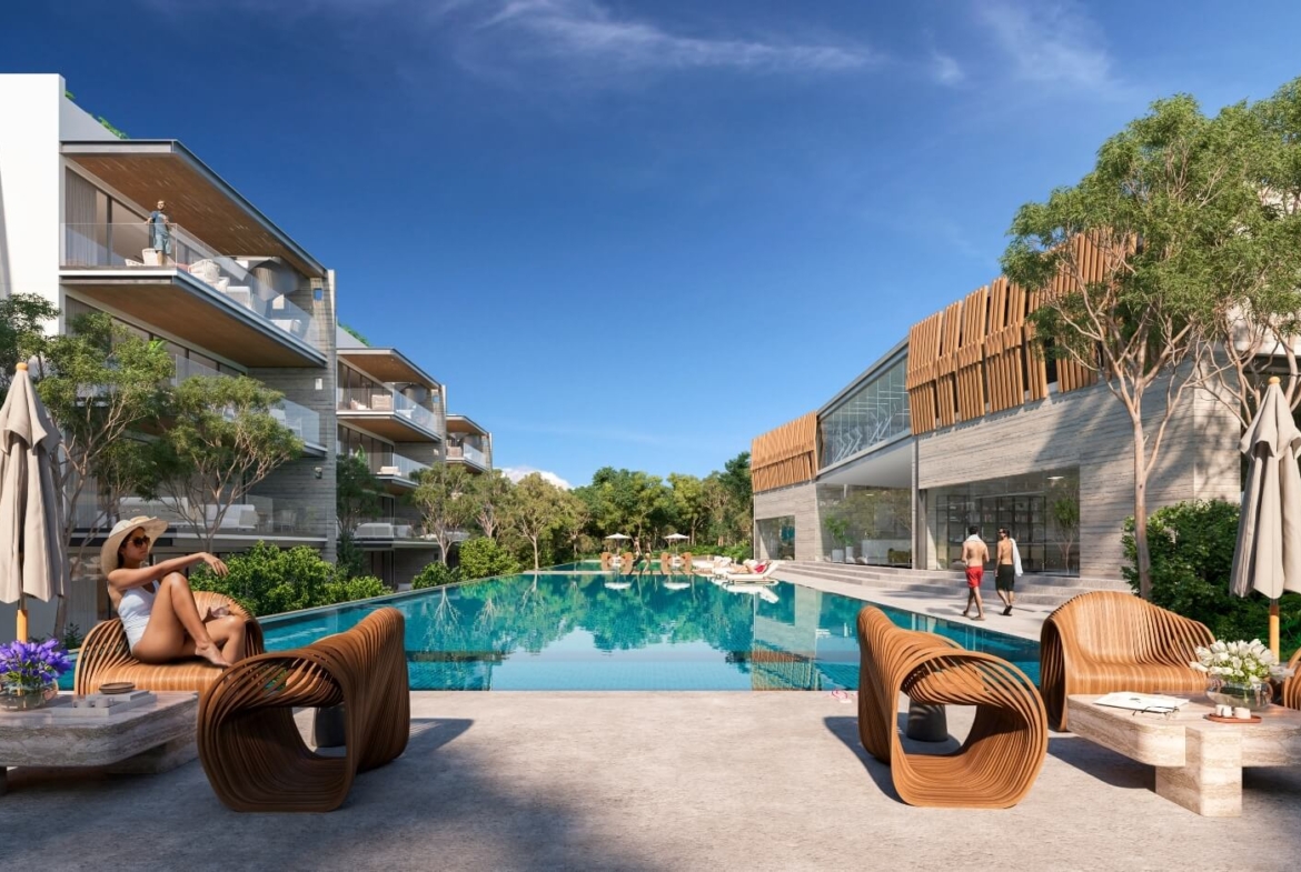 a pool with chairs and people walking around