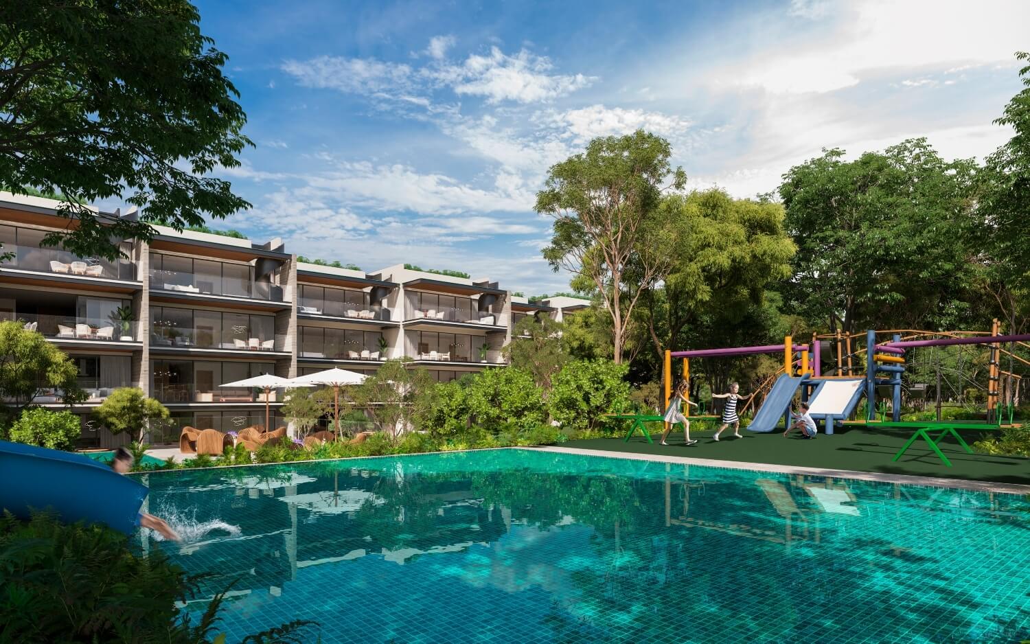 a pool with a slide and a building in the background